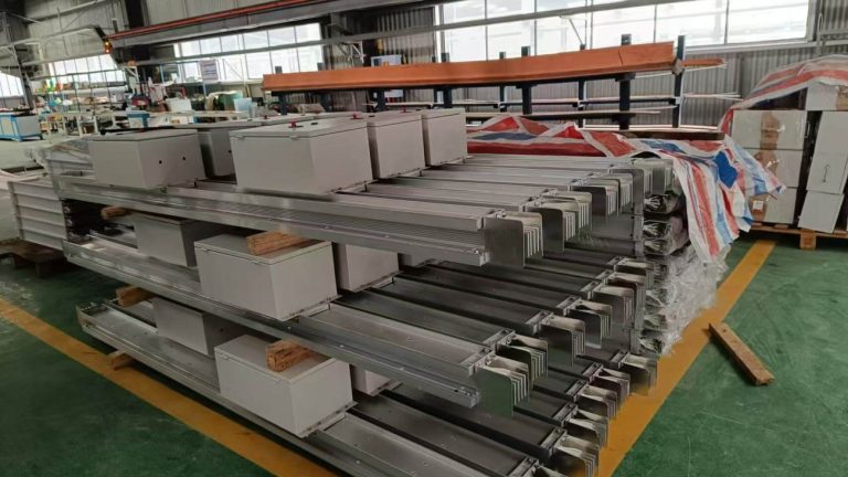 Stacked finished busway products in the factory workshop