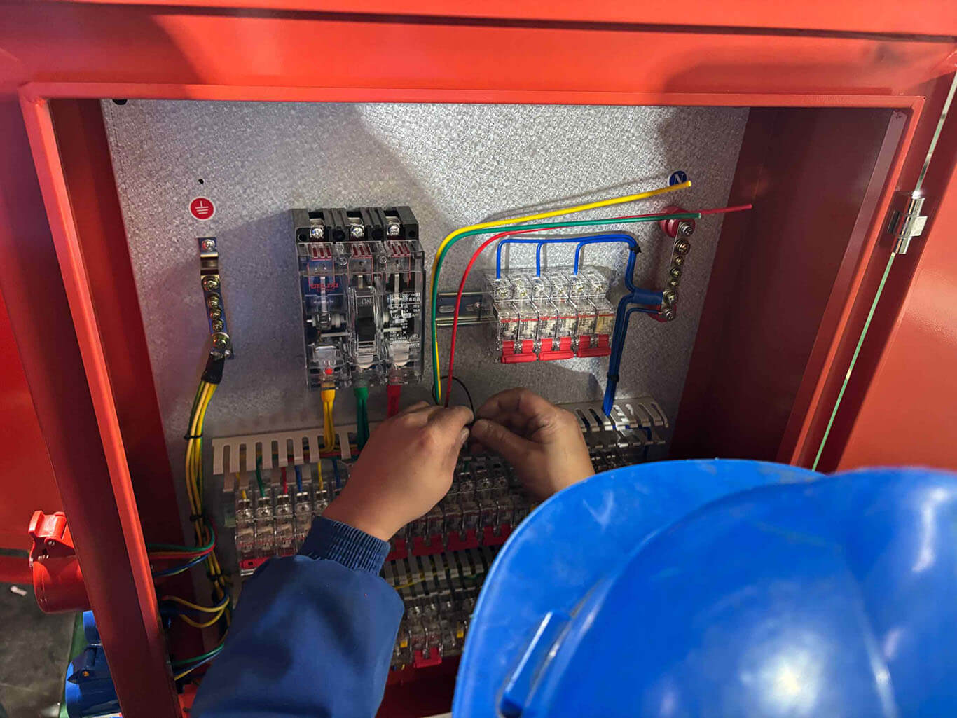 Wondon Close-up of orange Power Distribution Box wiring work